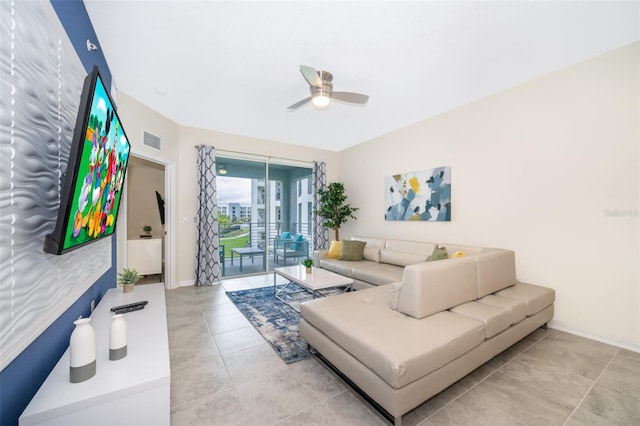 tiled living room with ceiling fan