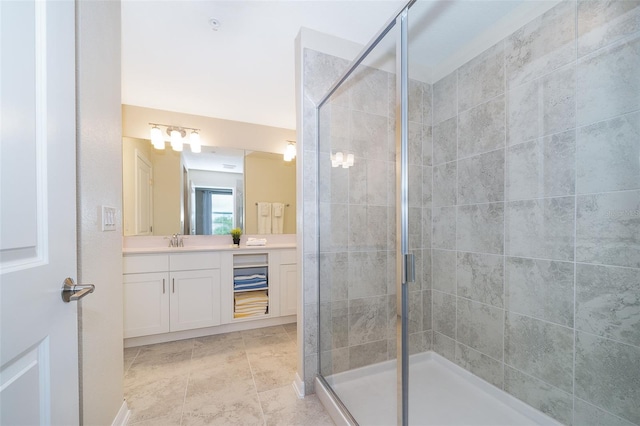 bathroom with tile patterned flooring, vanity, and a shower with shower door