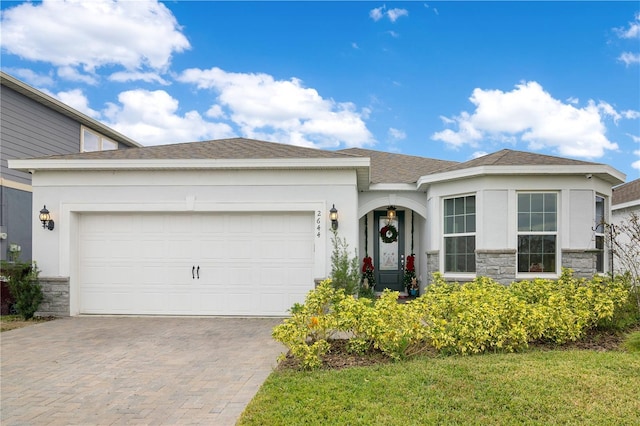 ranch-style house featuring a garage