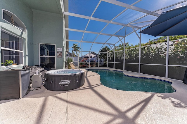 view of swimming pool featuring glass enclosure and a patio