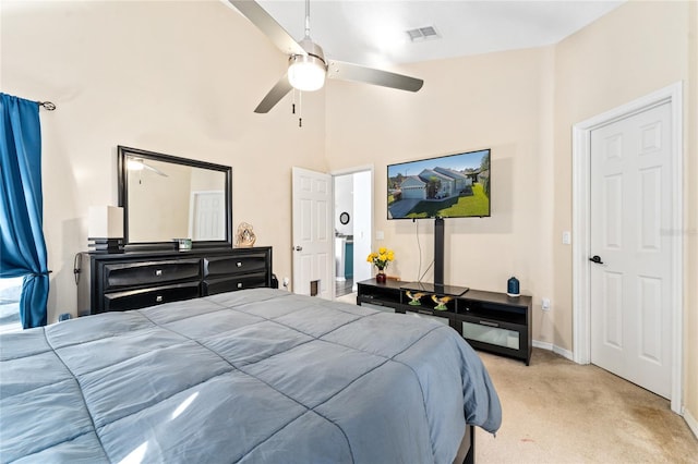 bedroom featuring ceiling fan, high vaulted ceiling, and light carpet