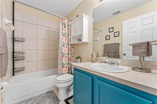 full bathroom with tile patterned flooring, a textured ceiling, toilet, vanity, and shower / tub combo