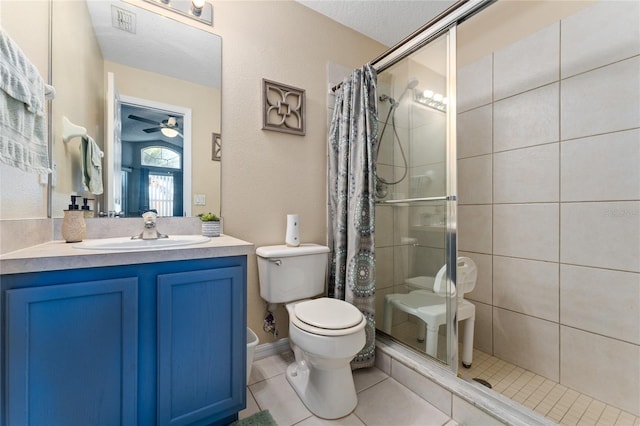 bathroom with vanity, tile patterned flooring, a shower with shower curtain, toilet, and a textured ceiling