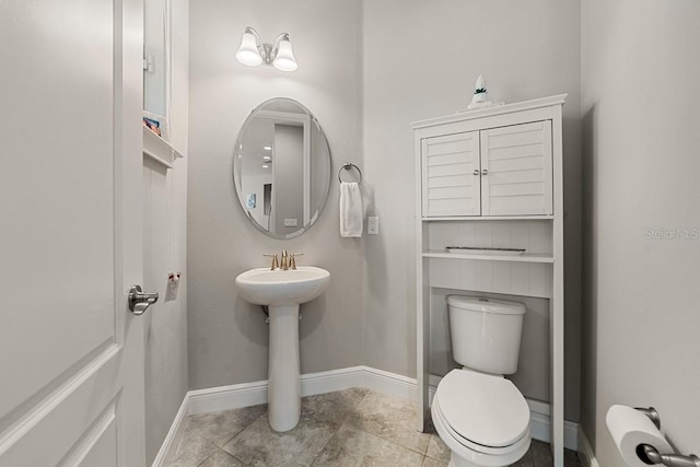 bathroom featuring tile patterned floors and toilet