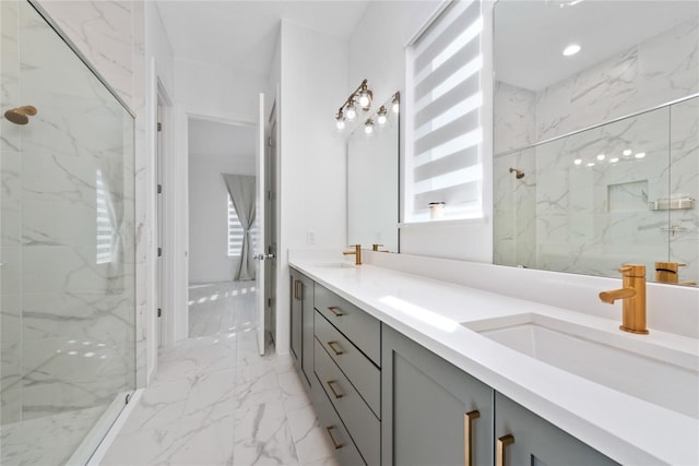 bathroom featuring a tile shower and vanity