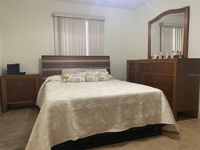 bedroom with hardwood / wood-style floors