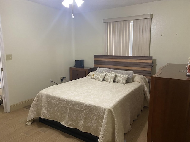 bedroom with light hardwood / wood-style floors