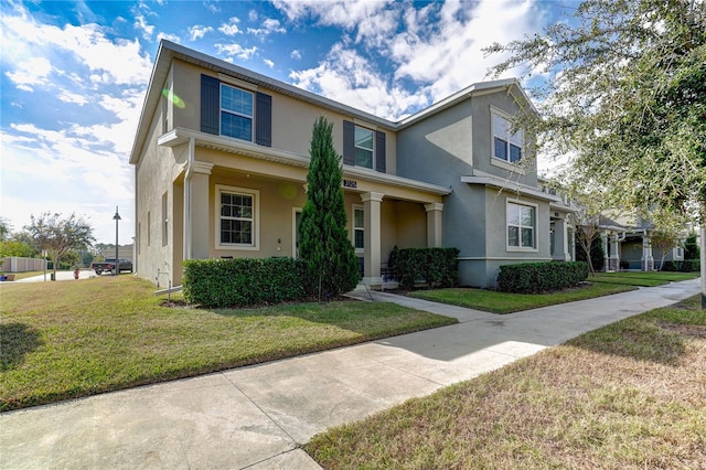 front facade featuring a front yard