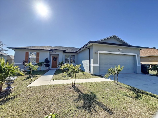 ranch-style home featuring a garage and a front lawn