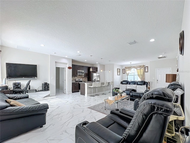 living room featuring a textured ceiling