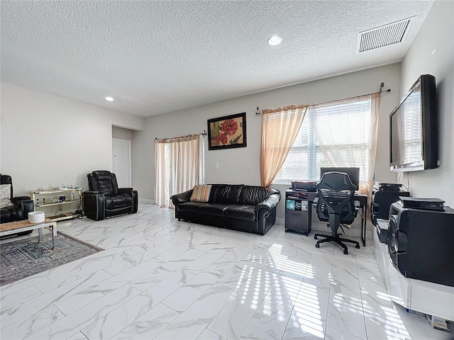 living room featuring a textured ceiling