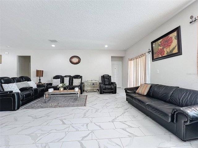 living room with a textured ceiling