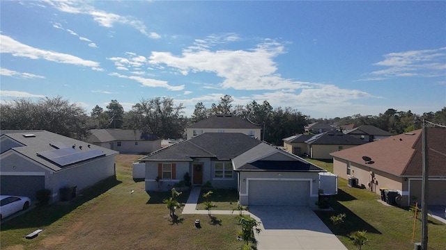 view of front of house with a front yard and a garage