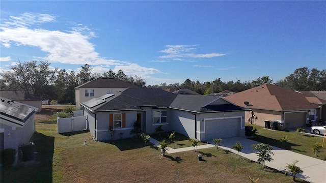 view of front facade with a front yard and a garage