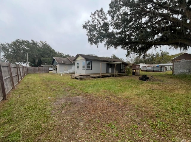 view of yard with a wooden deck