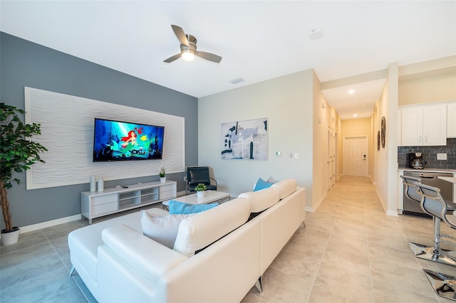 tiled living room featuring ceiling fan