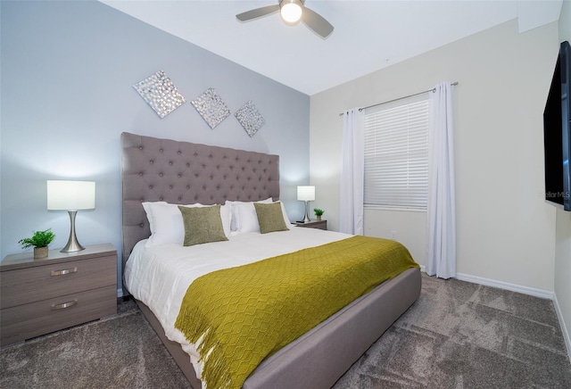 bedroom featuring ceiling fan, a closet, and dark colored carpet