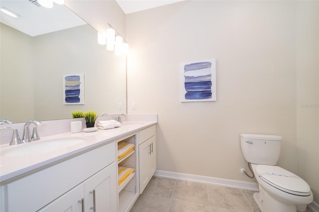 bathroom with tile patterned floors, vanity, and toilet