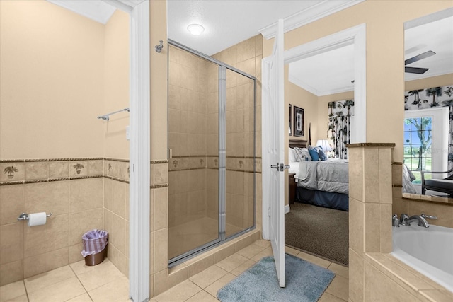 bathroom featuring tile patterned flooring, ceiling fan, ornamental molding, and plus walk in shower