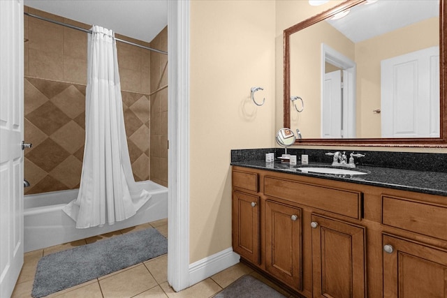 bathroom with shower / tub combo, vanity, and tile patterned floors