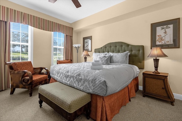 bedroom featuring light carpet and ceiling fan