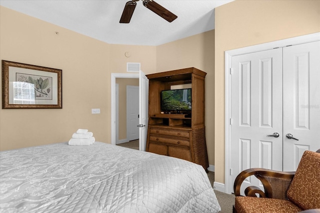 bedroom featuring carpet flooring, ceiling fan, and a closet