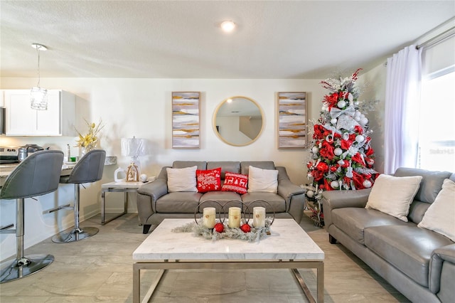 living room with a healthy amount of sunlight and a textured ceiling