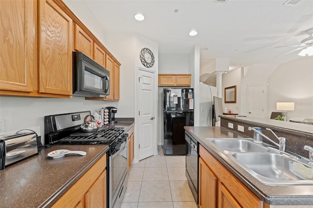 kitchen featuring ceiling fan, sink, decorative columns, light tile patterned flooring, and black appliances