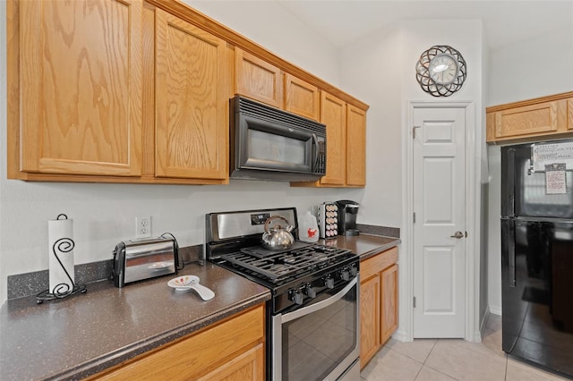 kitchen with light tile patterned floors and black appliances