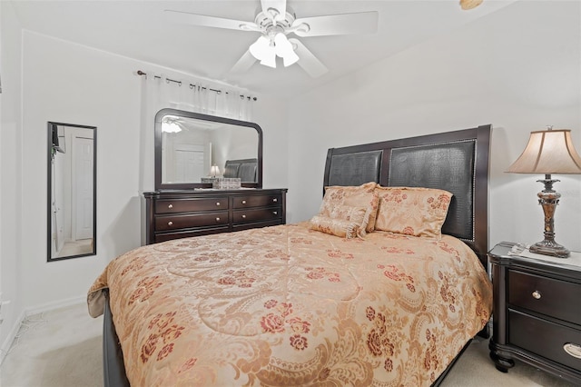 bedroom featuring ceiling fan and light colored carpet