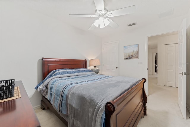 bedroom featuring ceiling fan and light colored carpet