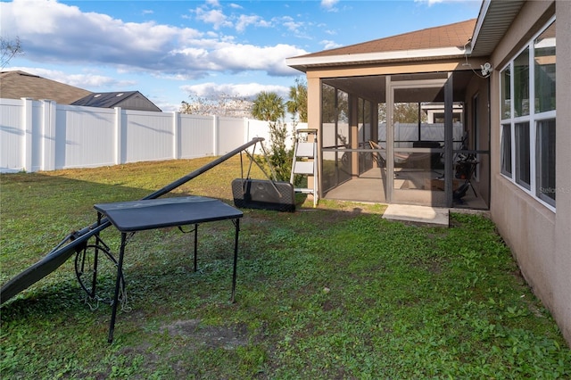 view of yard featuring a sunroom