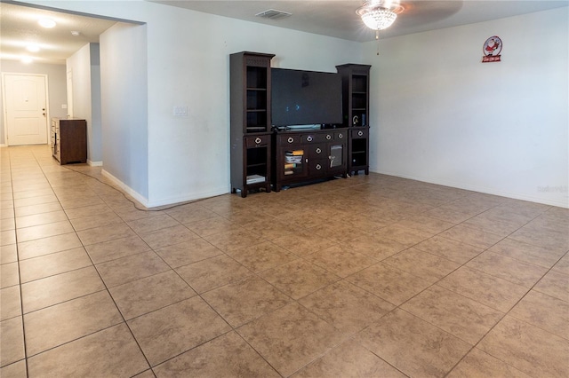 unfurnished living room with ceiling fan