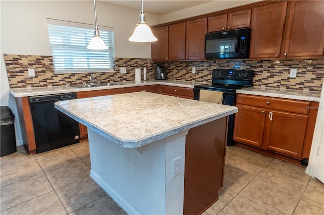 kitchen with backsplash, sink, black appliances, pendant lighting, and a center island