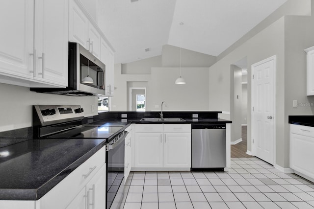 kitchen featuring white cabinetry, sink, lofted ceiling, and appliances with stainless steel finishes