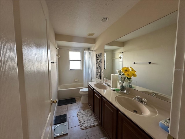 full bathroom with shower / bathtub combination with curtain, tile patterned flooring, a textured ceiling, toilet, and vanity