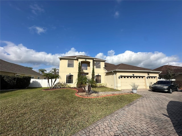 view of front of home featuring a garage and a front lawn