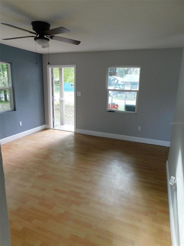 empty room featuring ceiling fan and light hardwood / wood-style floors