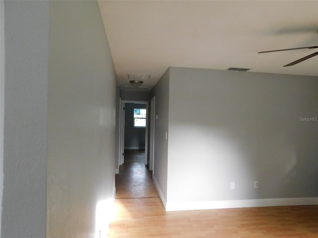 hall with light hardwood / wood-style floors