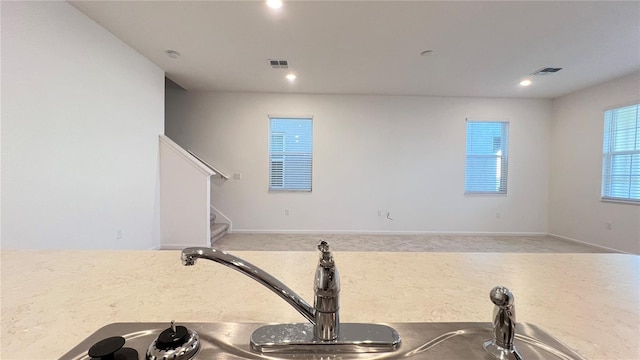 kitchen featuring light colored carpet