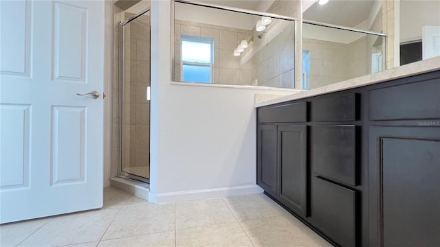 bathroom featuring tile patterned floors and a shower with shower door