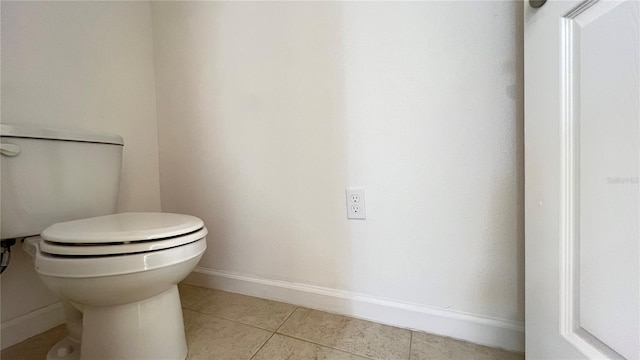 bathroom with tile patterned flooring and toilet