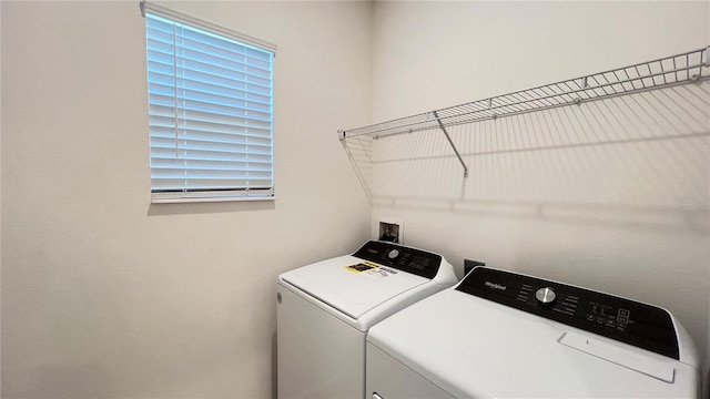 laundry area with separate washer and dryer