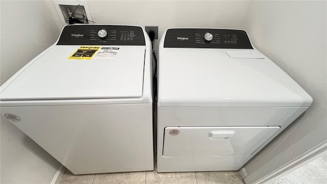 laundry area with separate washer and dryer