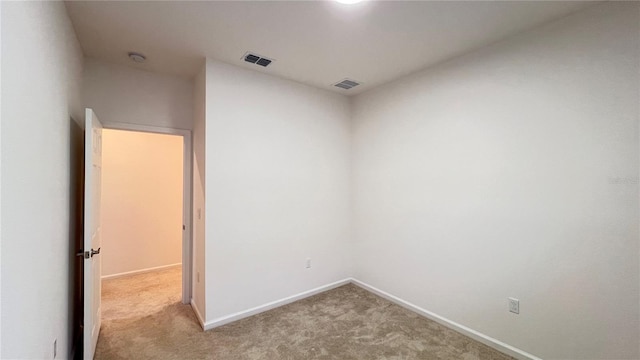 spare room with light carpet