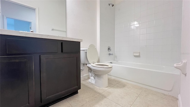 full bathroom with vanity, tile patterned floors, tiled shower / bath combo, and toilet