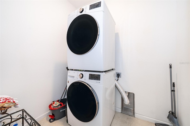 laundry room featuring stacked washing maching and dryer