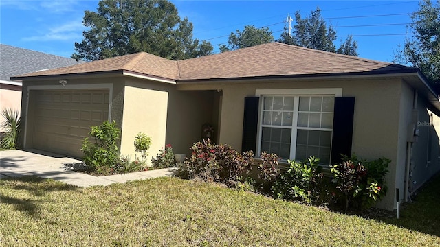 single story home with a garage and a front lawn