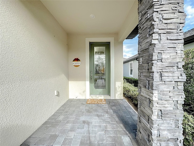 7959 Delwin Ln, Kissimmee, FL 34747 - view of exterior entry with stucco siding