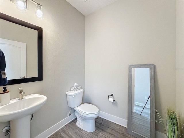 bathroom with toilet and sink